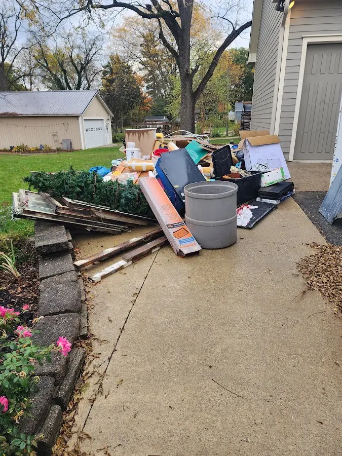Dumpster being loaded with debris for Commercial Dumpster Rental in Macedonia